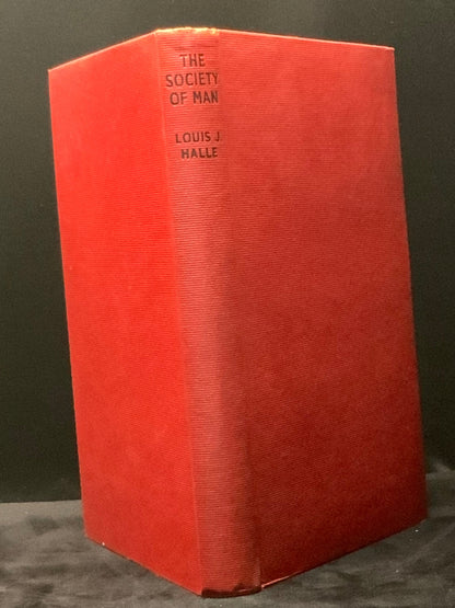 Red book titled 'The Society of Man' by Louis J. Halle on a dark background